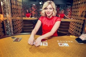 L336 live casino table with dealer and players interaction